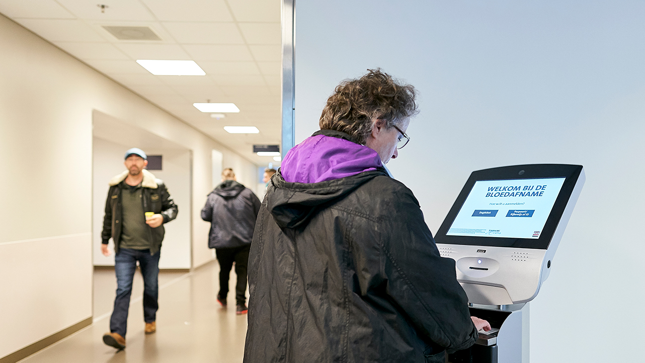 Check in at the self check-in point at the patient lab
